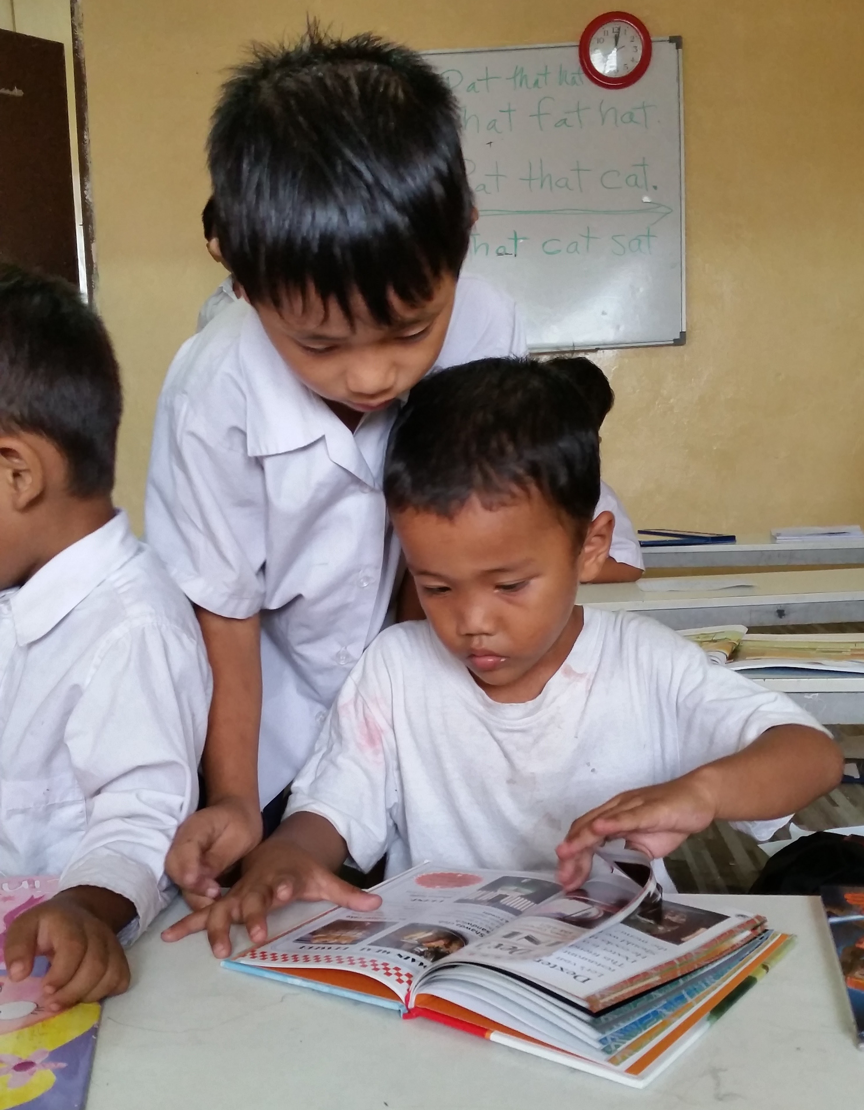 Engaged in books at the Myanmar Refugee School KL Malaysia